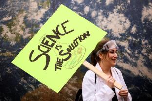 A protestor holds a sign in support of science during the March For Science in Seattle, Washington